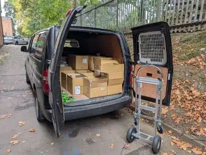electrical recycling collection with a black van